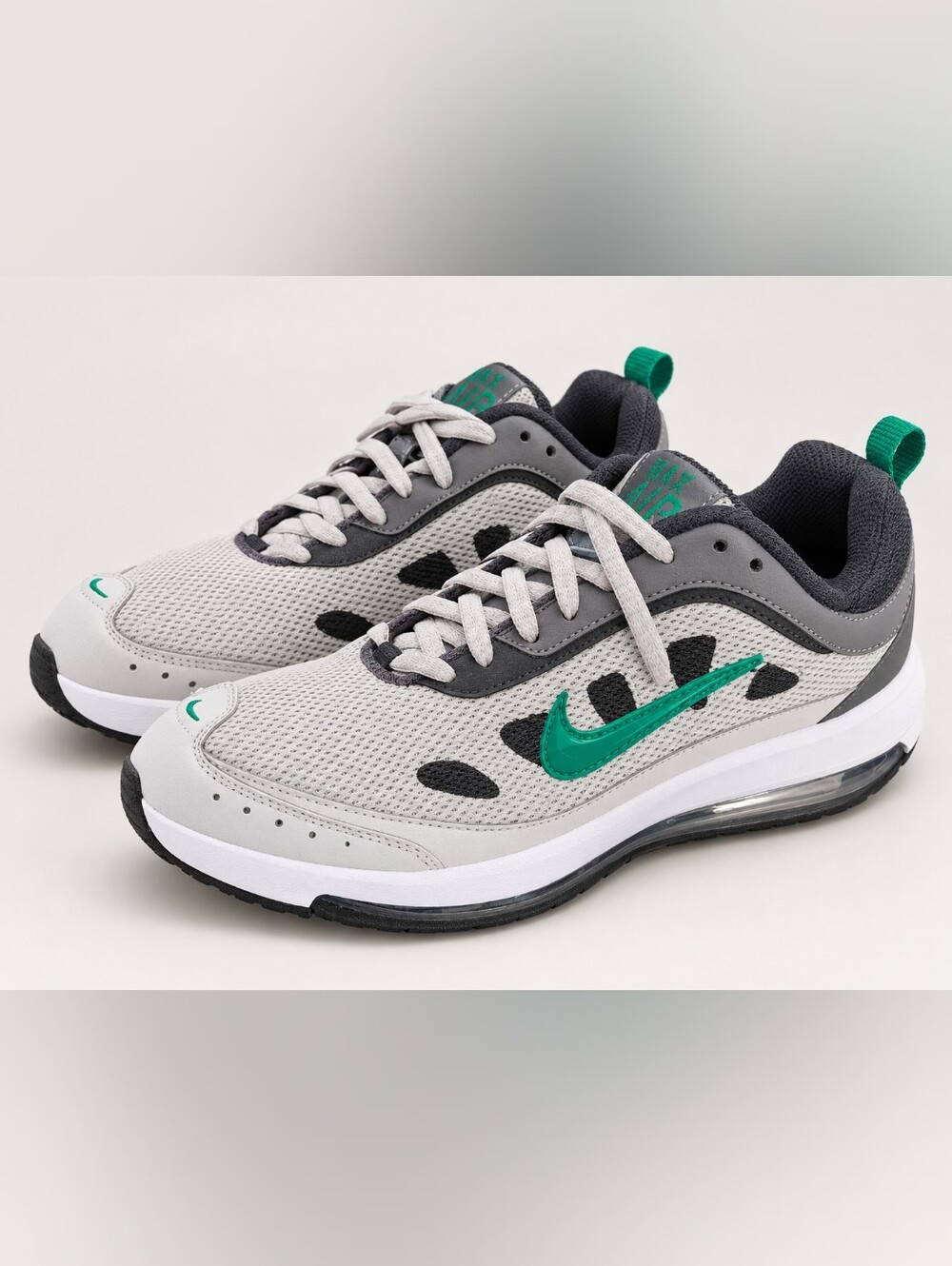 Nike Men’s Light Gray Athletic Sneakers with Green Swoosh